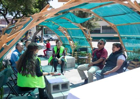 City residents gather to talk under a new shaded shelter