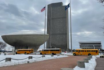 School buses near tower in New York
