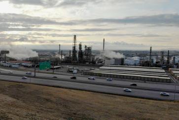 Oil refinery behind a highway in Utah.